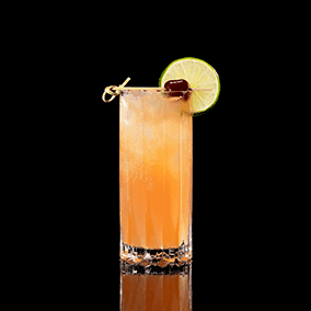 A closeup of a Bay Breeze drink against a dark background.