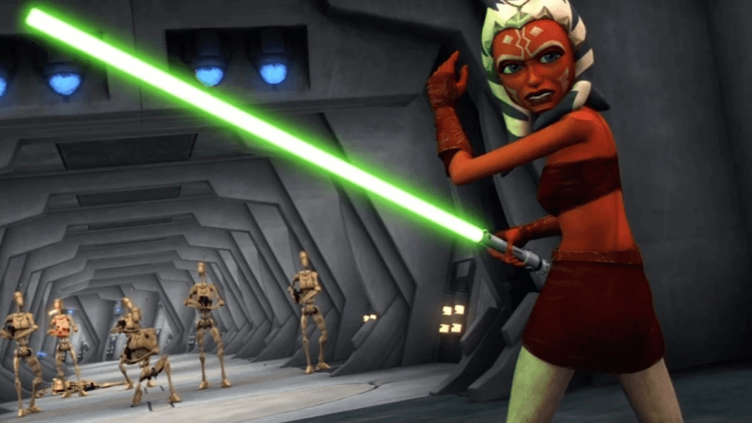 Ahsoka Tano in a red tube top wielding a green lightsaber against battle droids