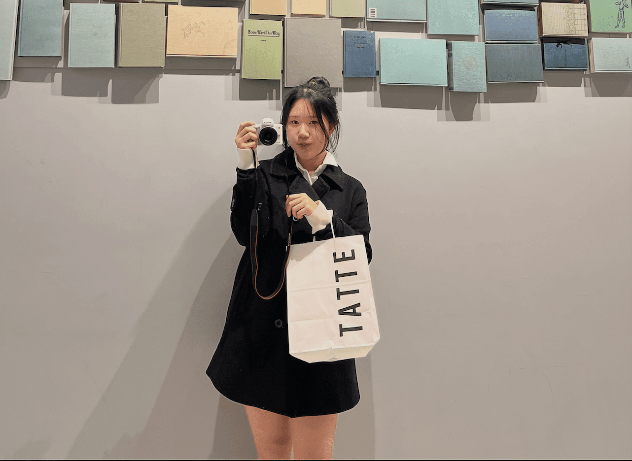 man in black and white striped long sleeve shirt taking photo of man in black shirt