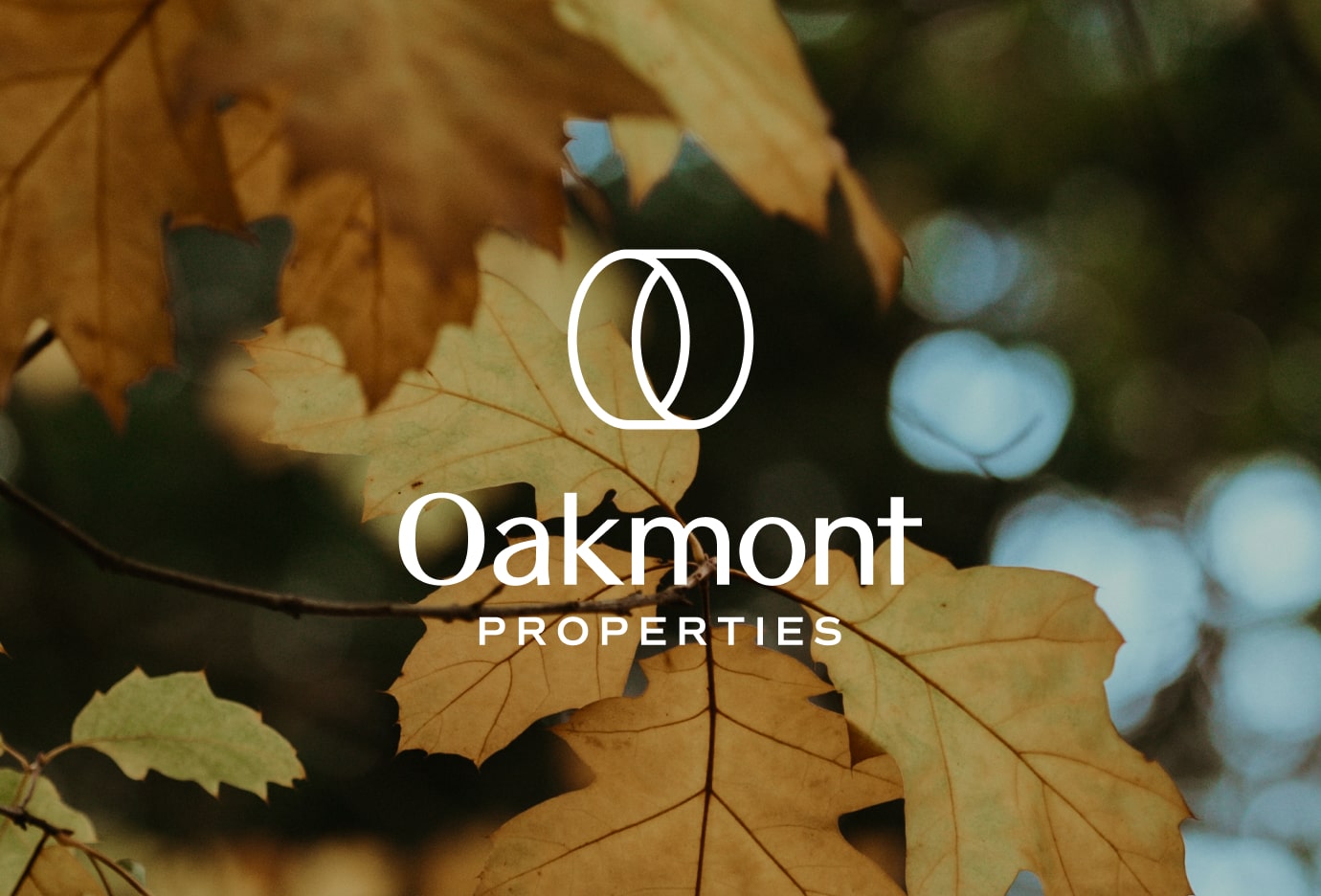 Close-up shot of leaves with the Oakmont logo overlaid.