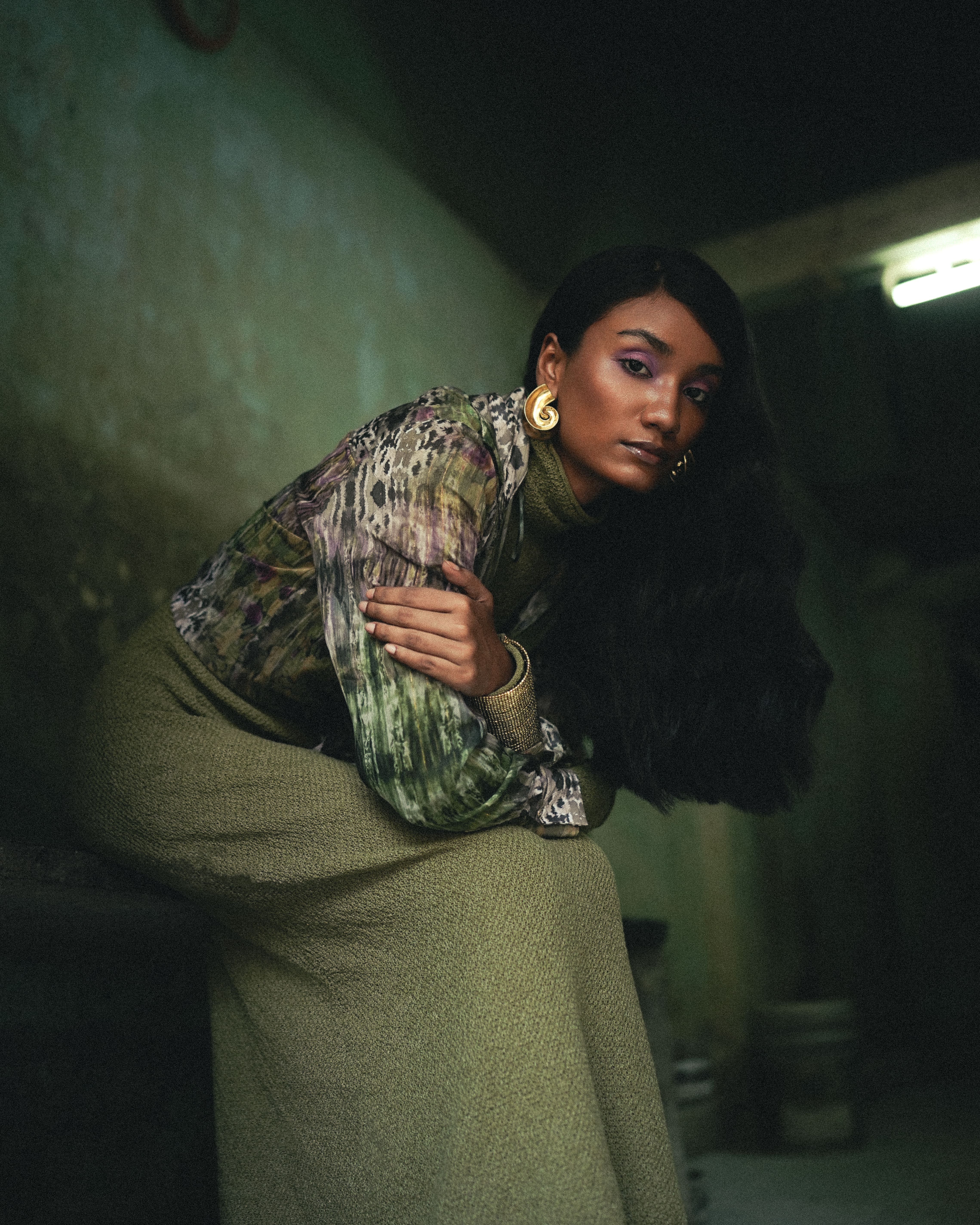 Group of friends smiling on a lively city street at night
