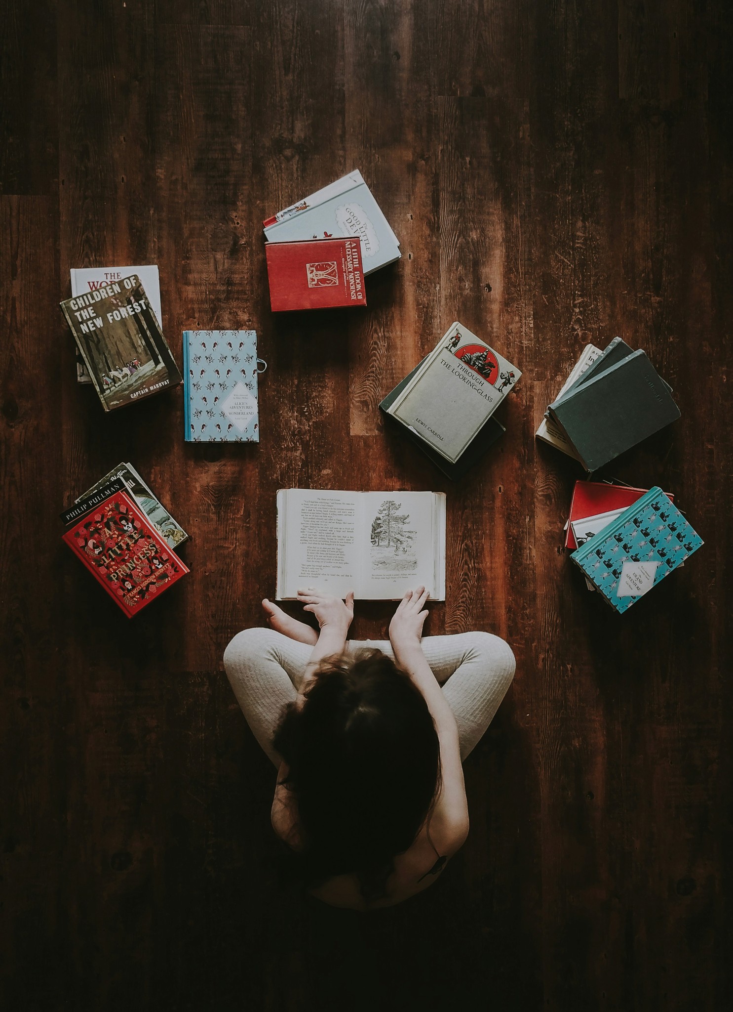 human focused in studies with books spread open