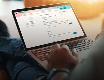 person sitting on the sofa with a laptop - screen showing a very long form