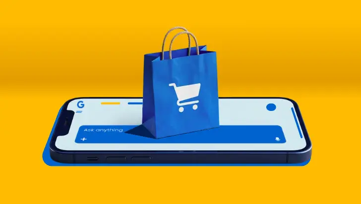 Ecommerce shopping bag on a smartphone with Google AI search bar for PPC advertising.
