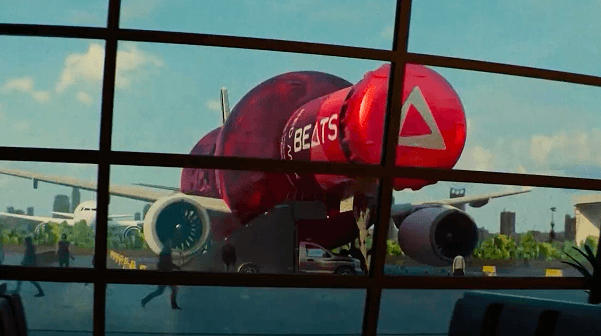 A fast black sports car races down the highway.