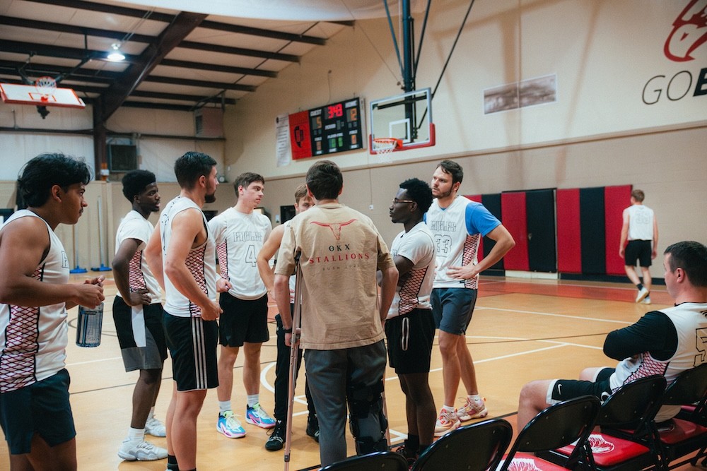 Our alumni team taking a timeout during our basketball alumni game