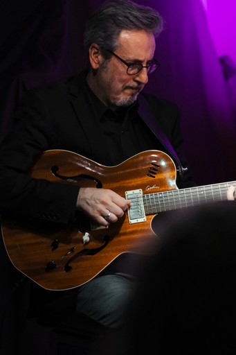 Jack Pantazis holding his guitar