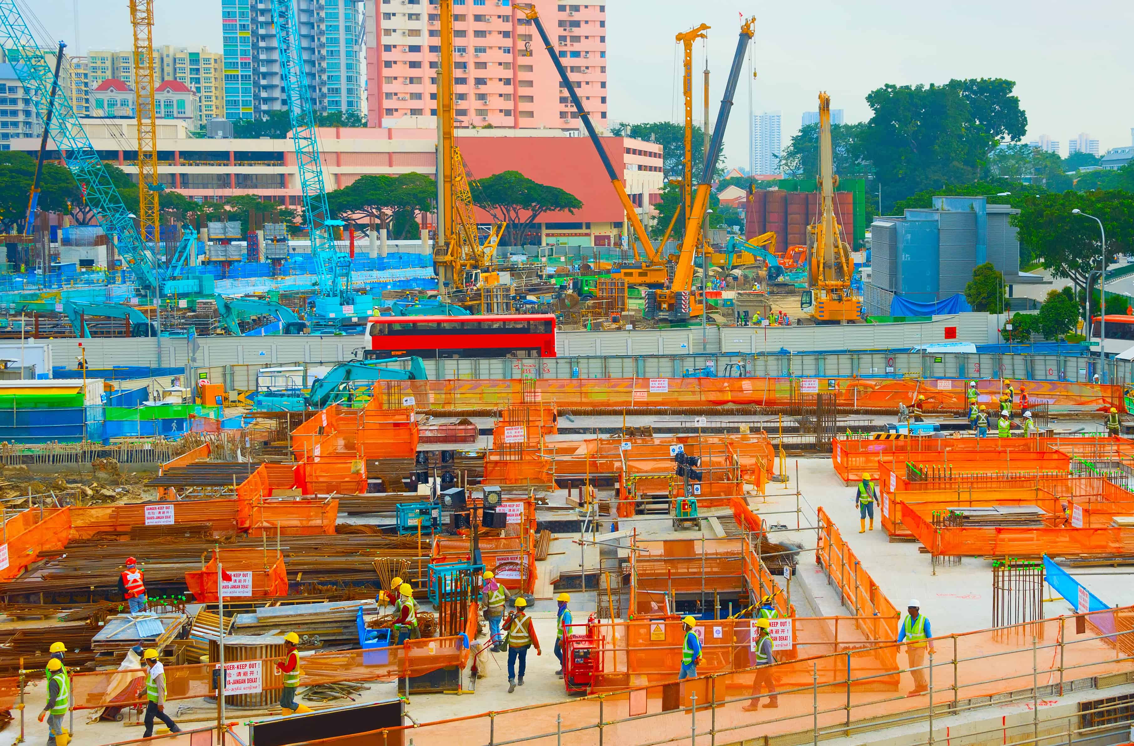 Construction site in Singapore managing complex operations, fatigue and heat management