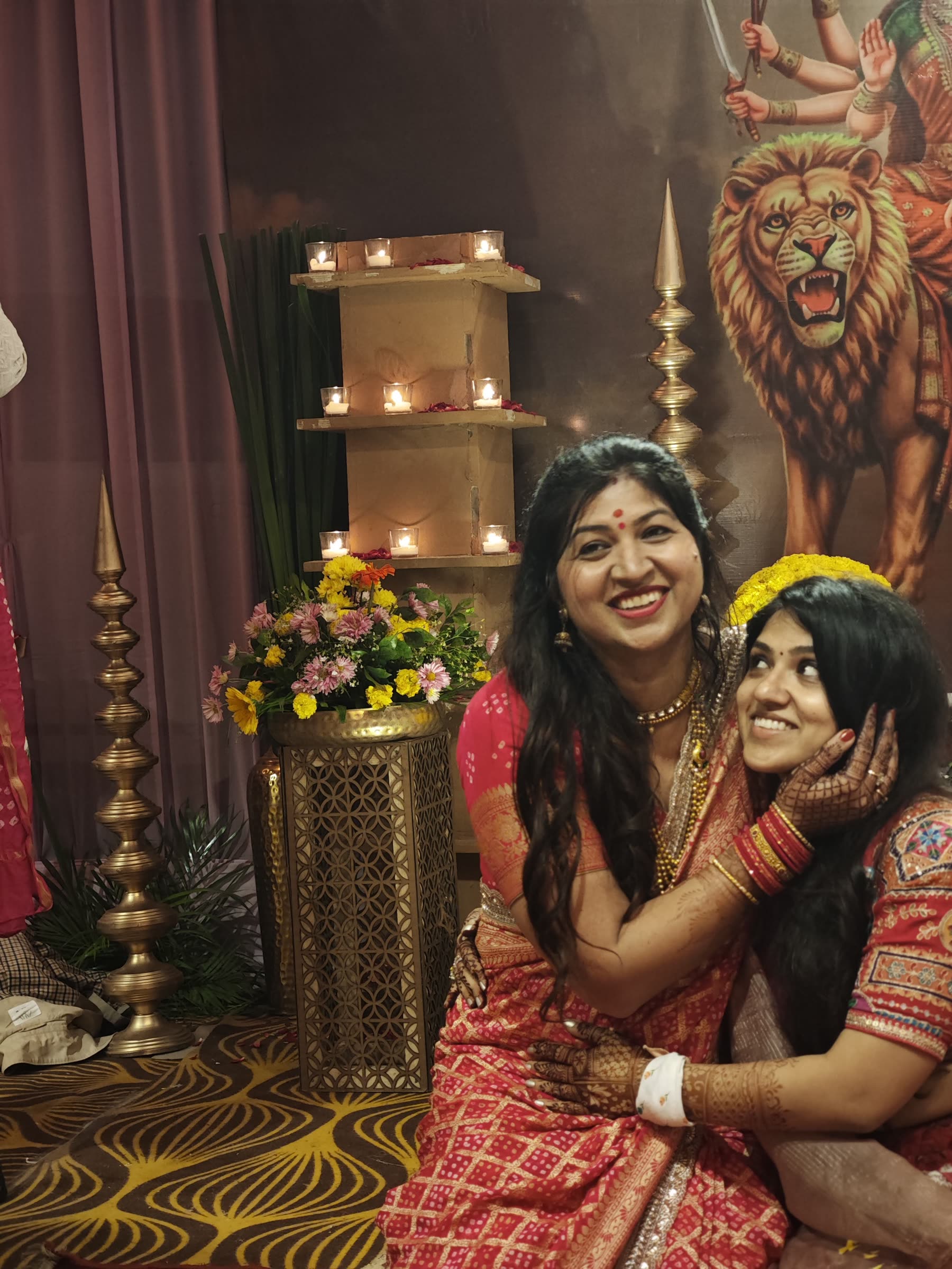 Two women sharing a warm ceremonial moment