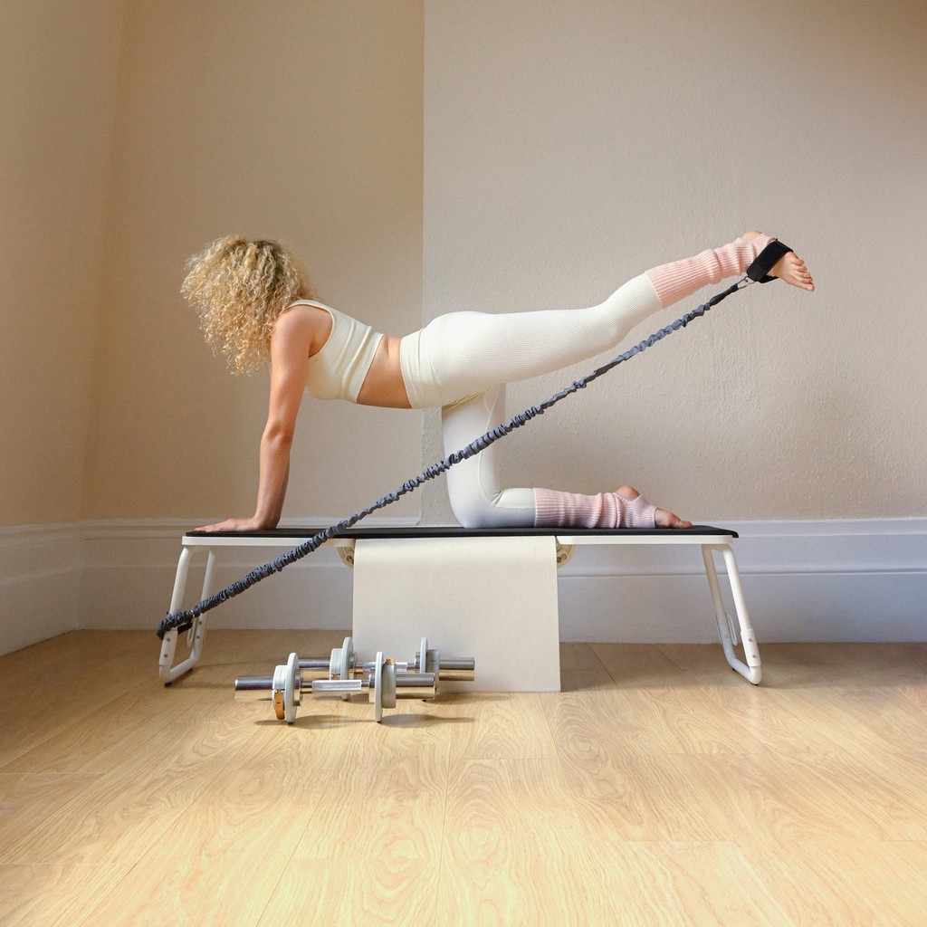 TonerBox home gym in use, resistance band exercise