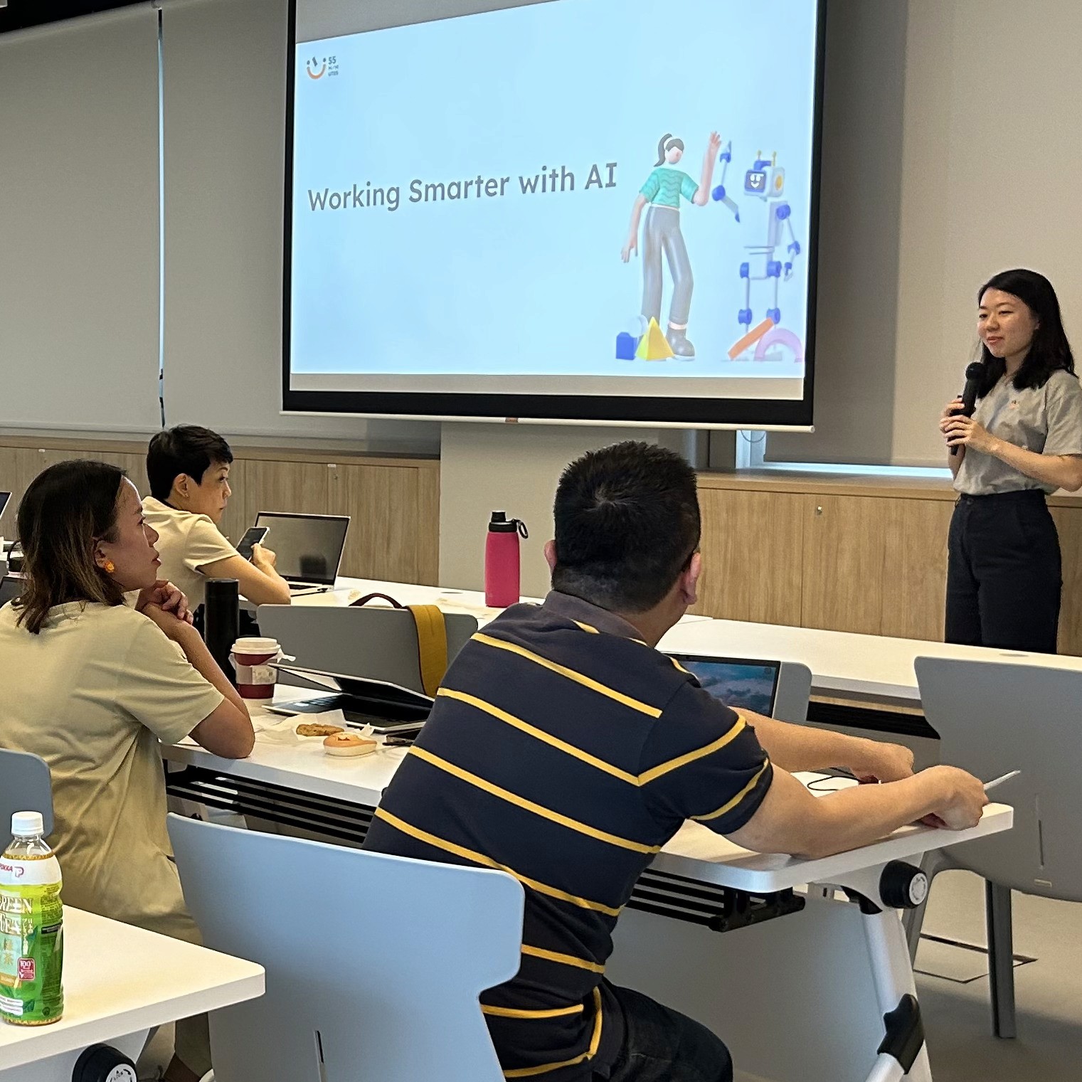 Trainer facilitating the 'Working Smarter with AI' workshop
