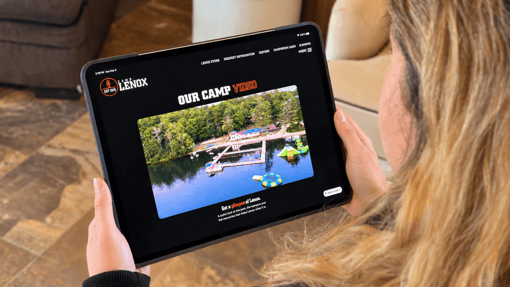 Tablet showing the Camp Lenox camp video