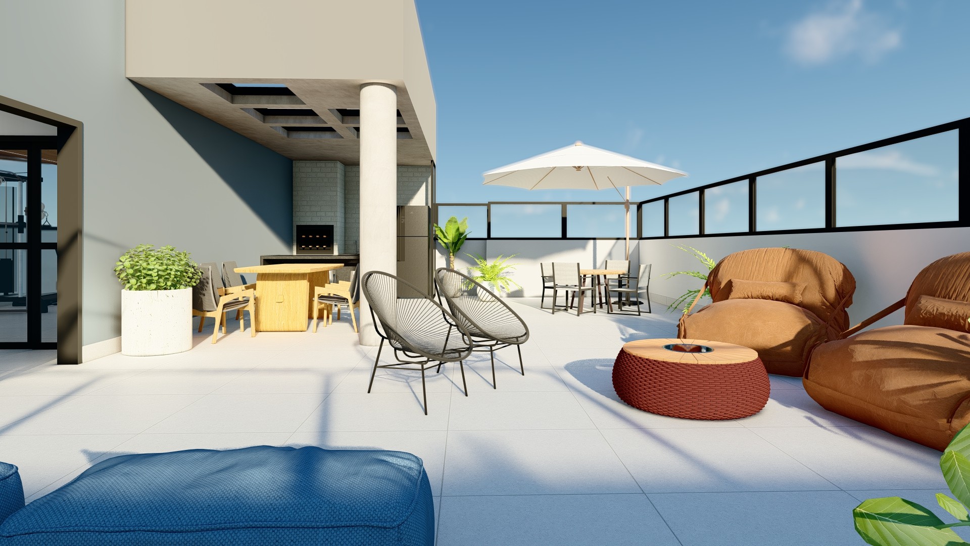 Rooftop patio with modern furniture, including beanbag chairs, a small fire pit, and a dining table, with a bright blue sky.