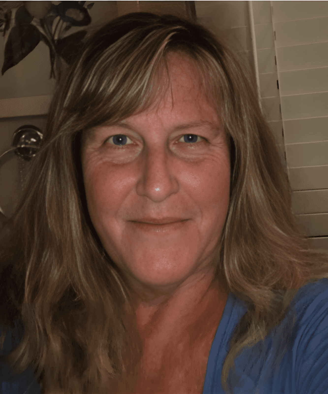 Laure Stack, a woman with long blonde hair in a blue shirt, advocates for courage and curiosity in children's storytelling.