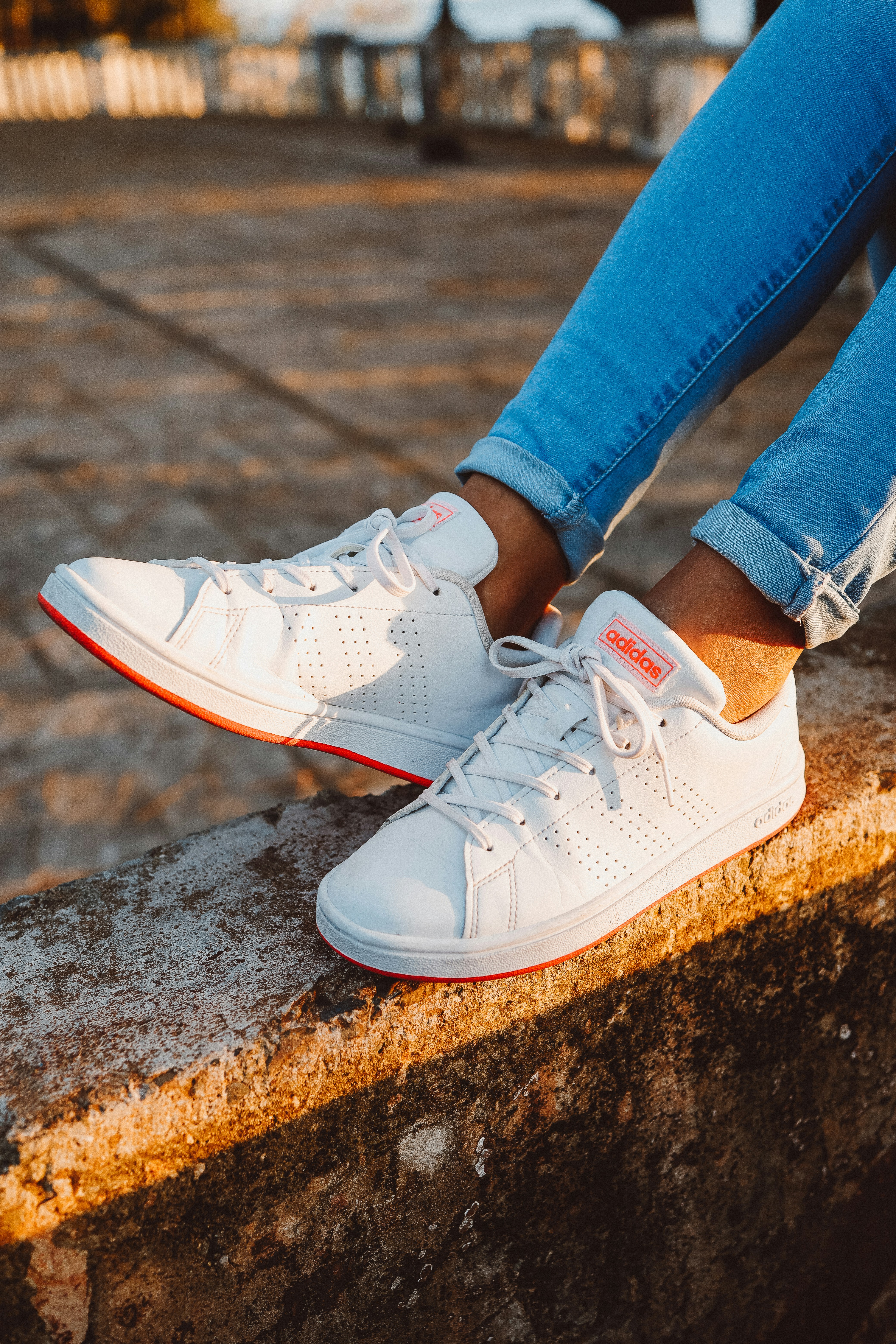 a close up of feet wearing blue shoes