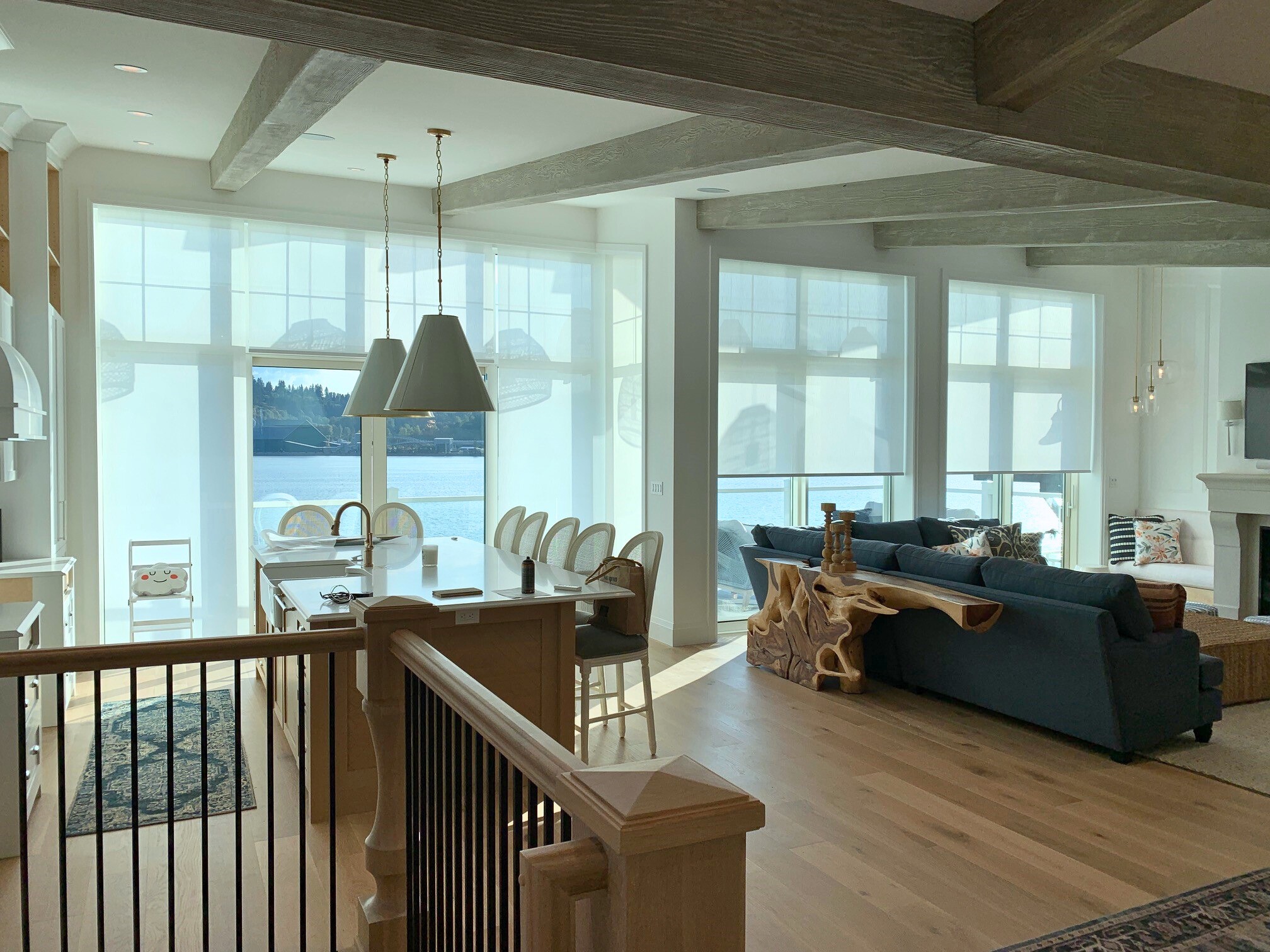 a brown couch sitting in front of a window