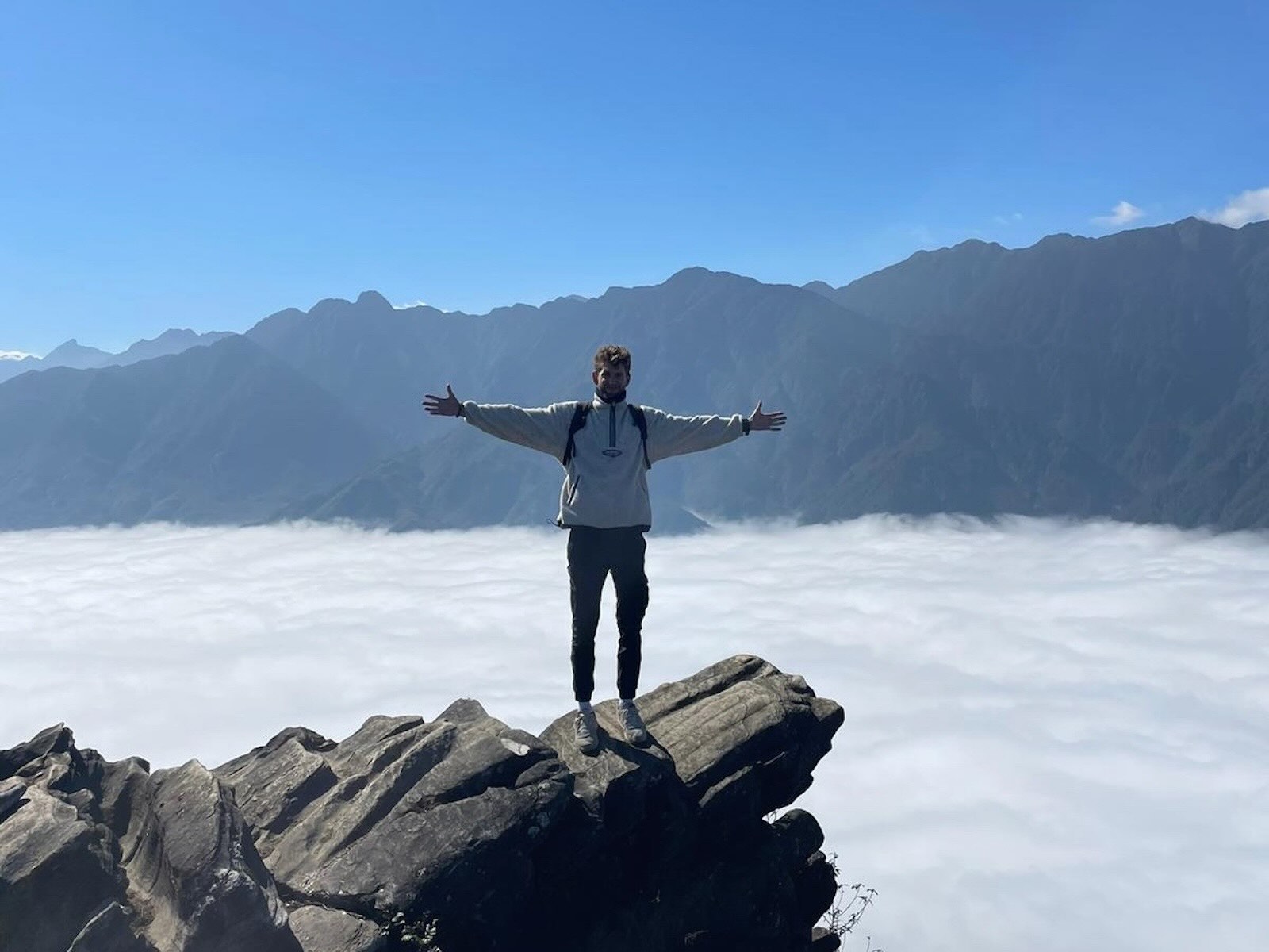 Dragon Jaw Mountain viewpoint above the clouds during a trek in Sapa Vietnam