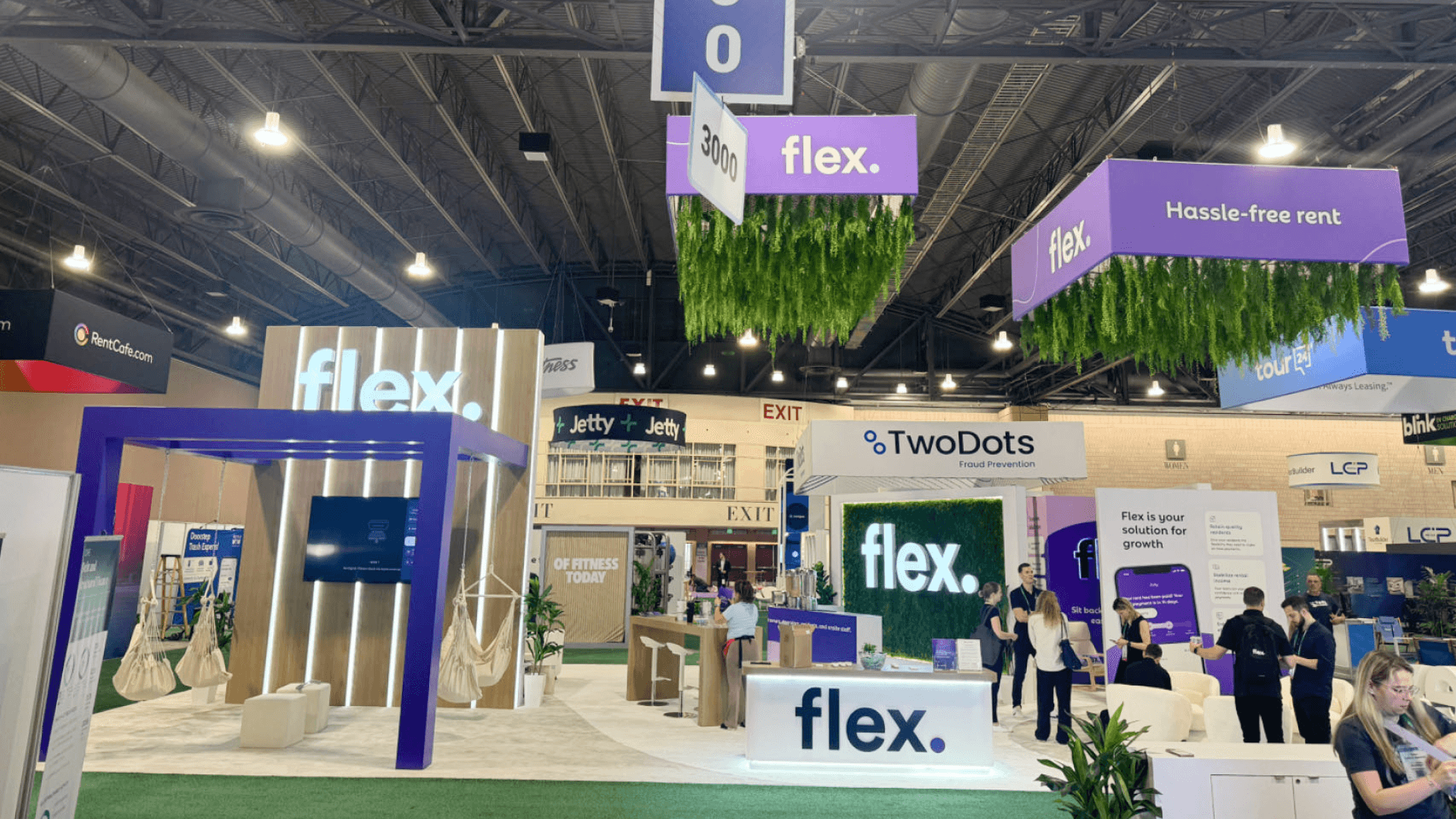 Wide angle of Flex big island booth layout showing lounge zoning and visitor circulation at NAA 2024