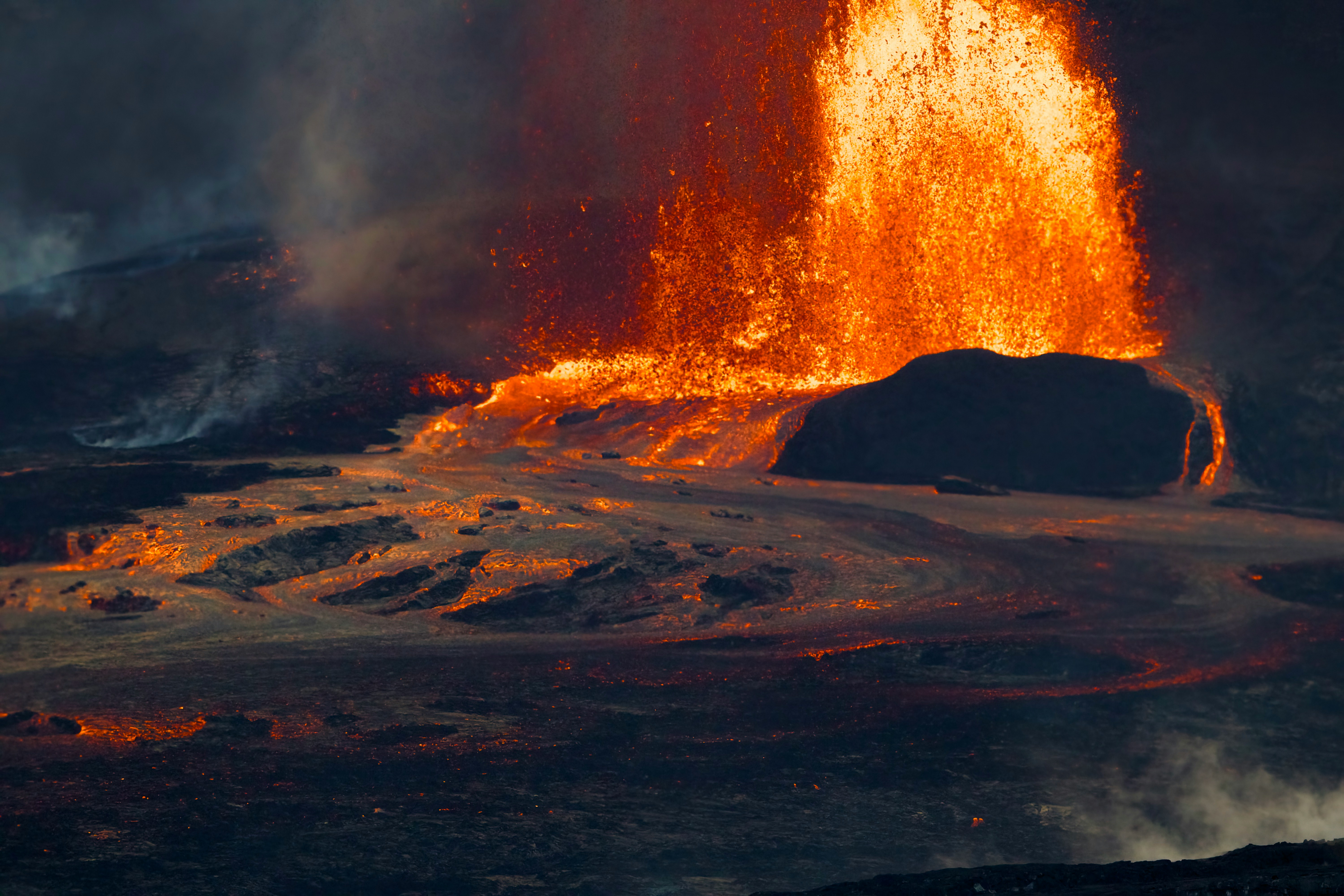 Fiery lava erupts from a volcano during an eruption.