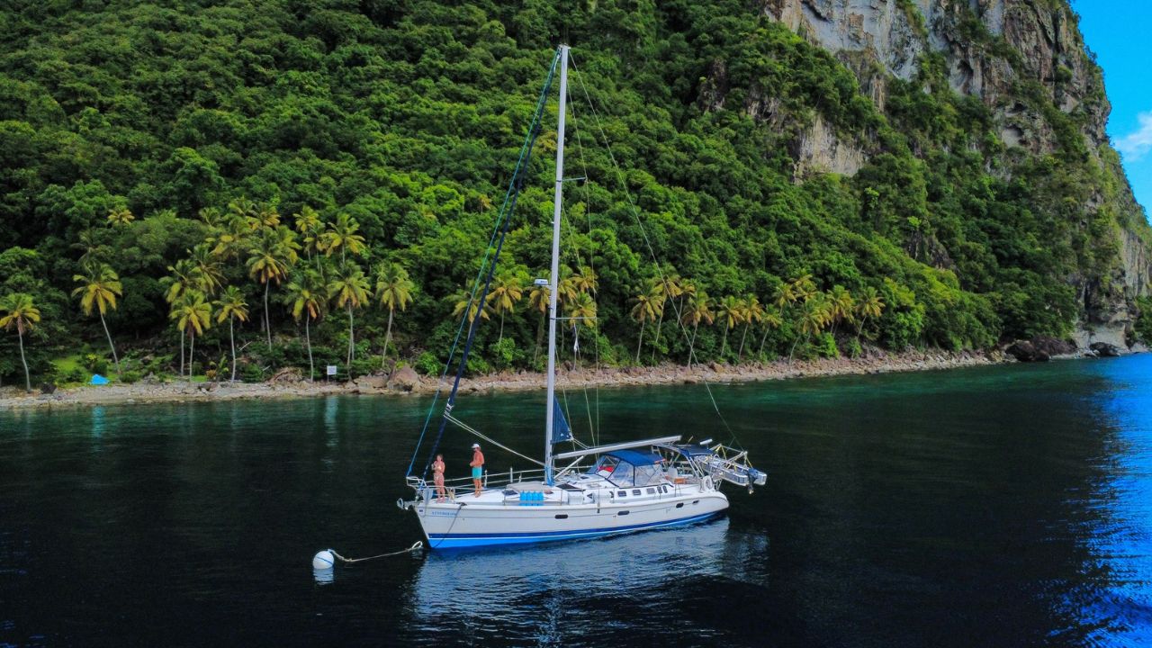 Sailing Afterglow’s Hunter 460 anchored off a Caribbean island