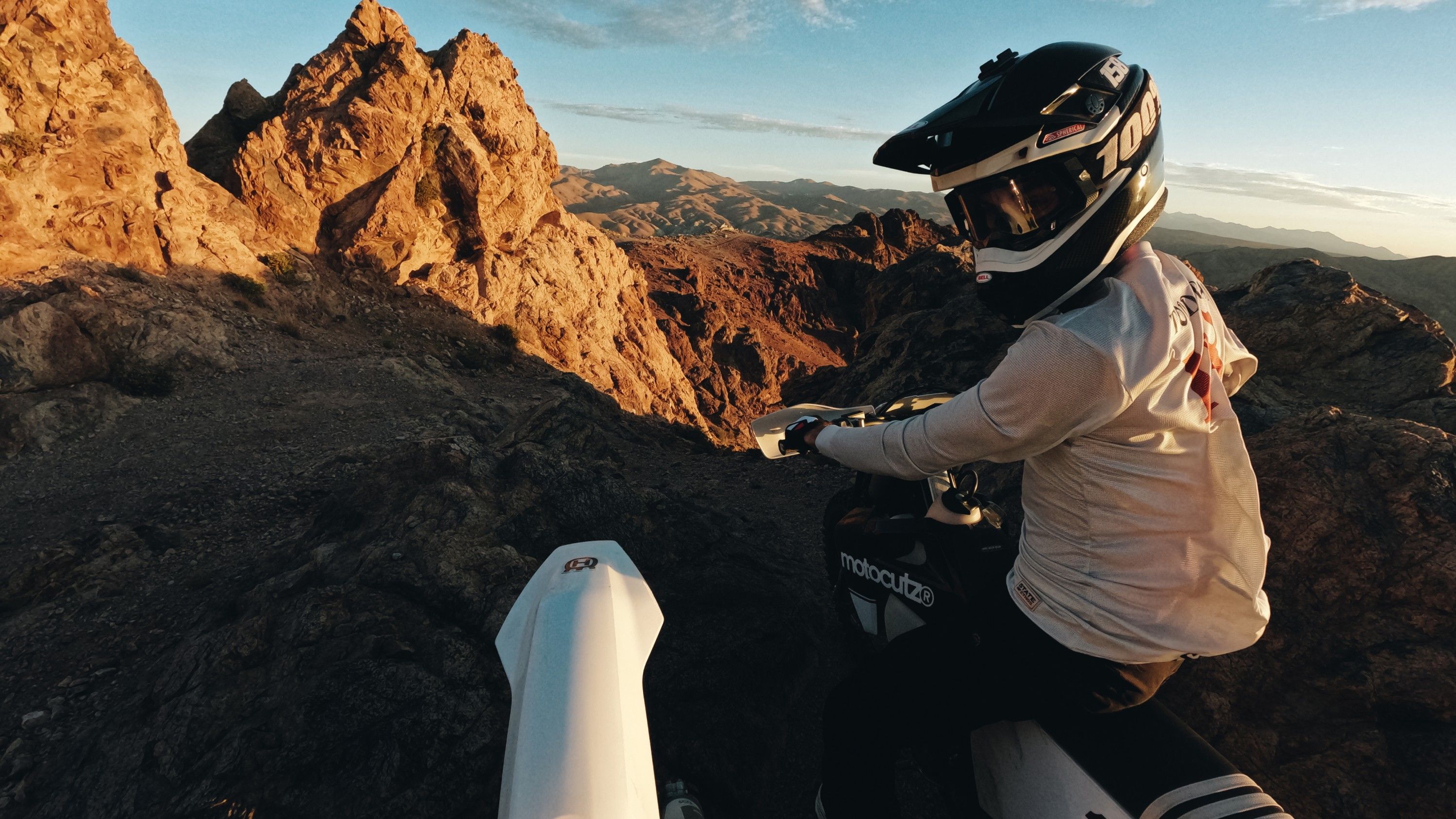 Adventure rider capturing outdoor journeys with TrailBit 64GB microSDXC storage for action cameras.