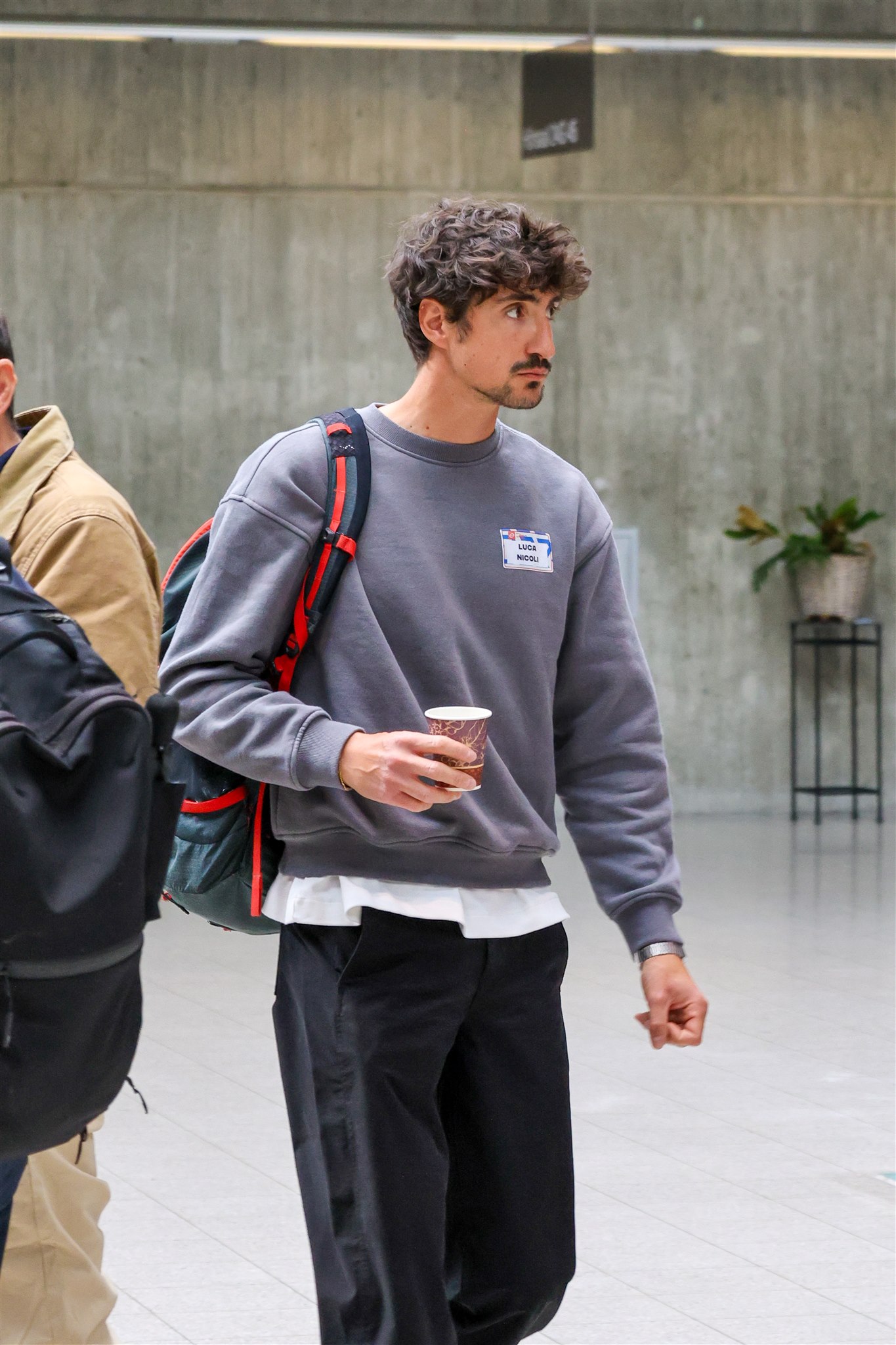 Attendee walking between sessions at EthereumZüri event in Zurich