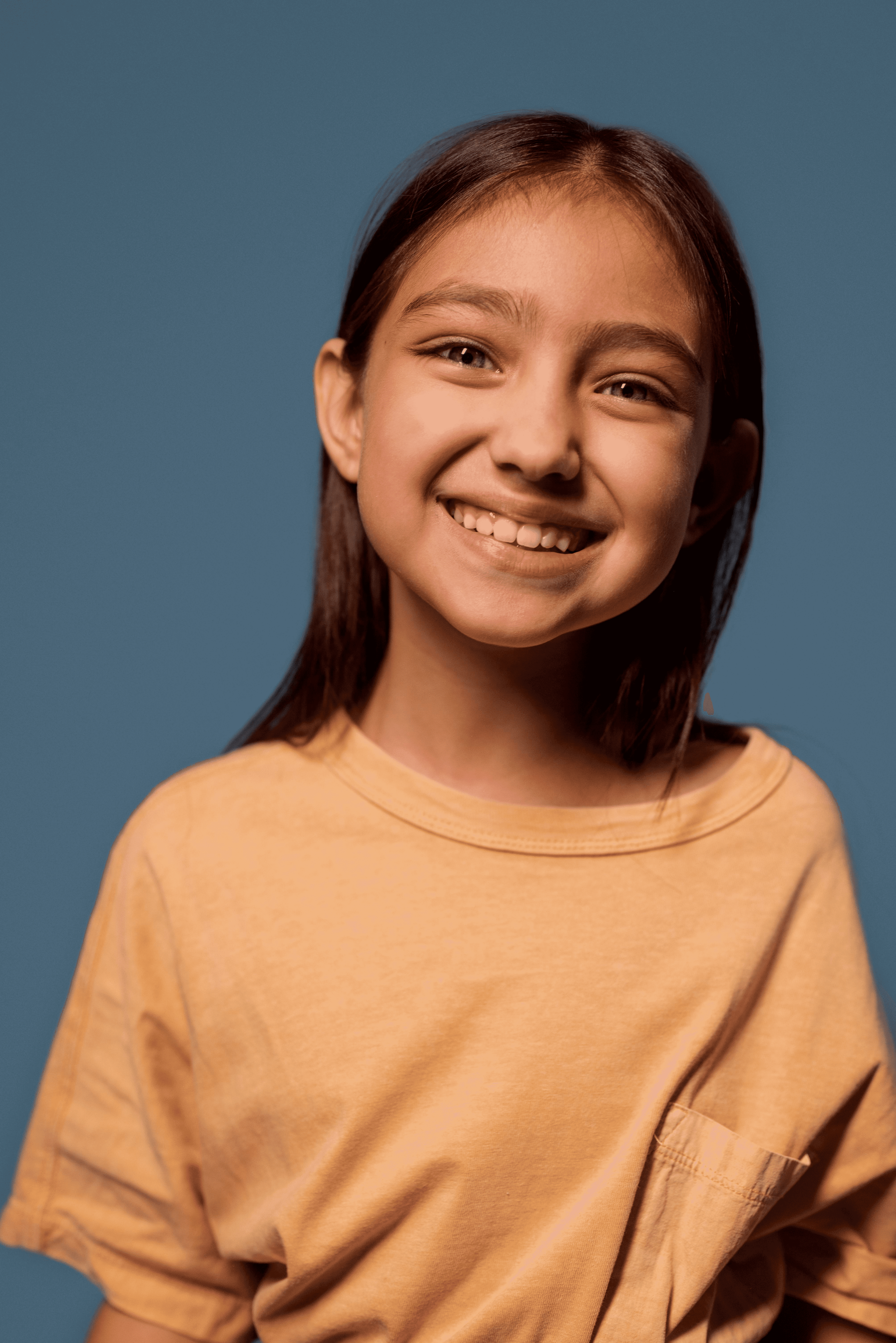 a close up of a child brushing her teeth