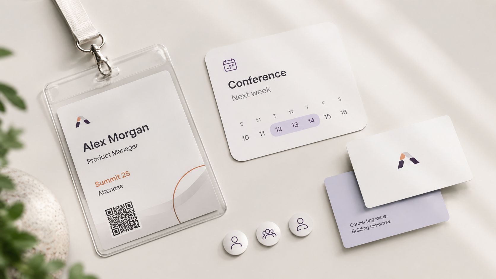 A professional conference badge, a calendar schedule, and branded business cards arranged on a clean desk surface.