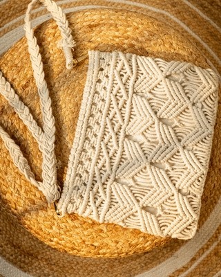 Handcrafted macrame sling bag with textured cotton weave
