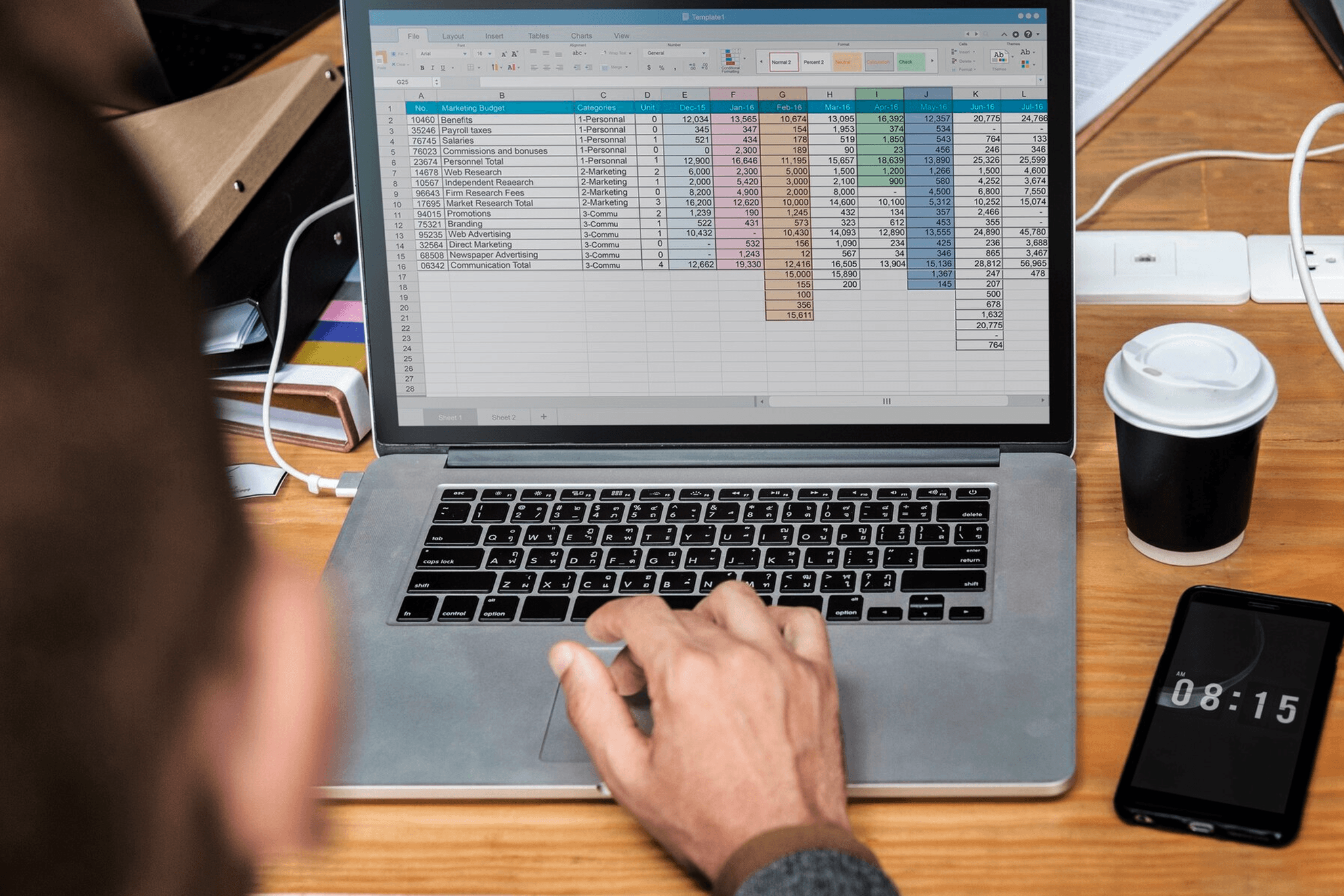 Person analyzing marketing budget - How to Create a Financial Model in Google Sheets