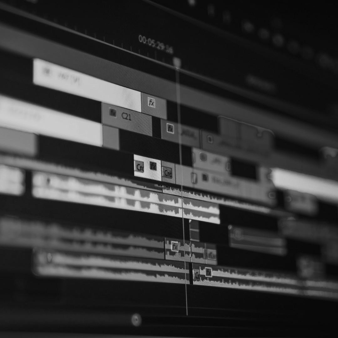 Portrait of a person in a pink sweater against a light background