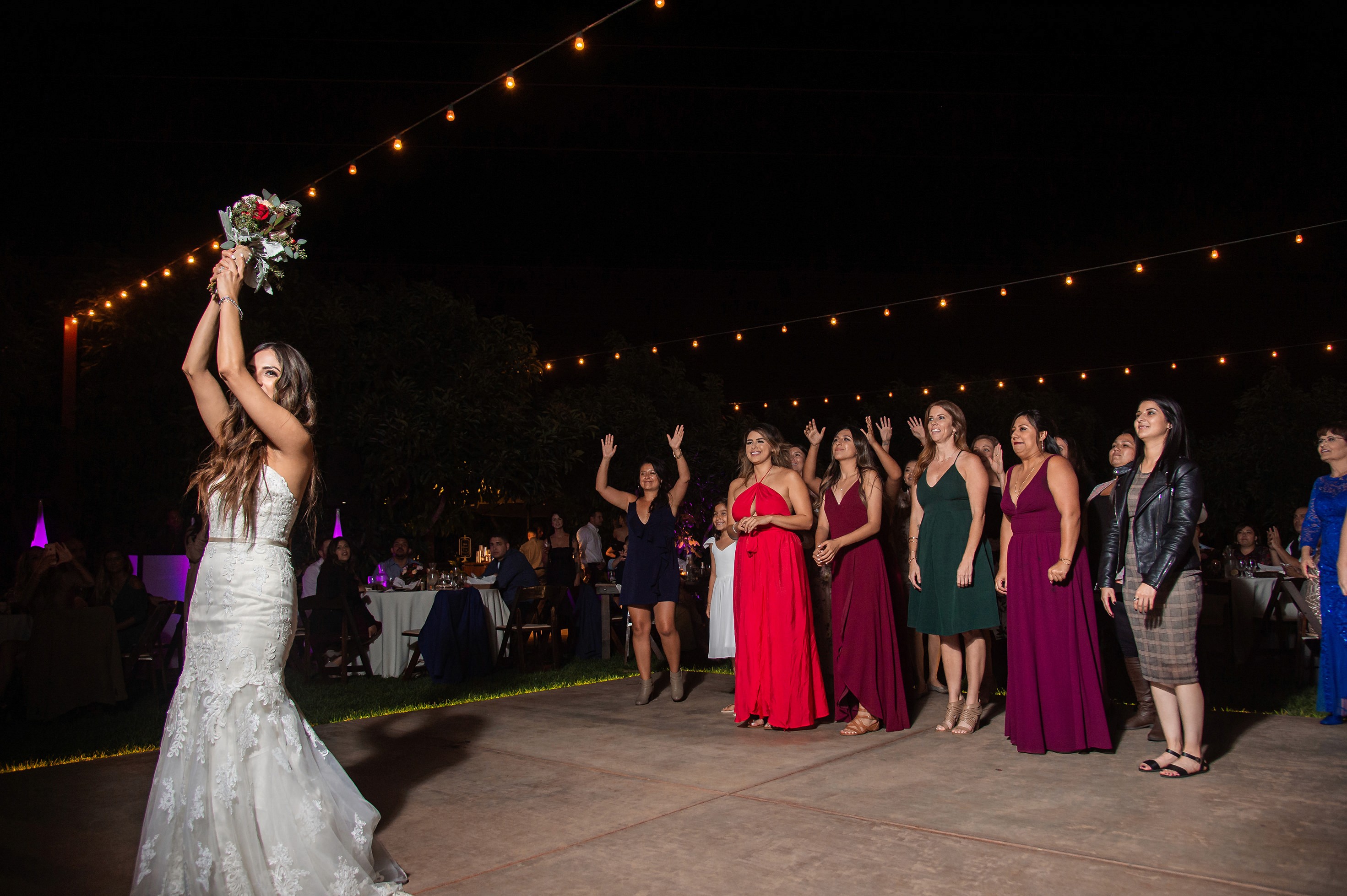 Flat lay wedding details with bouquet, rings, and sparkling bridal heels