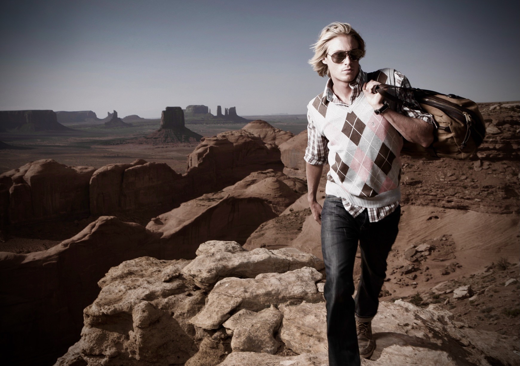 Male fashion portrait in a monumental desert landscape