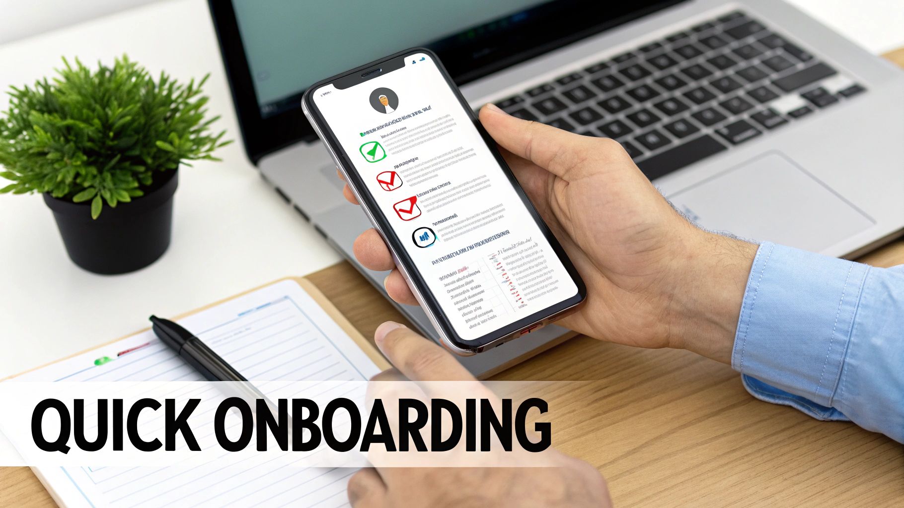 A person's hand holds a smartphone displaying a quick onboarding app, next to a laptop.