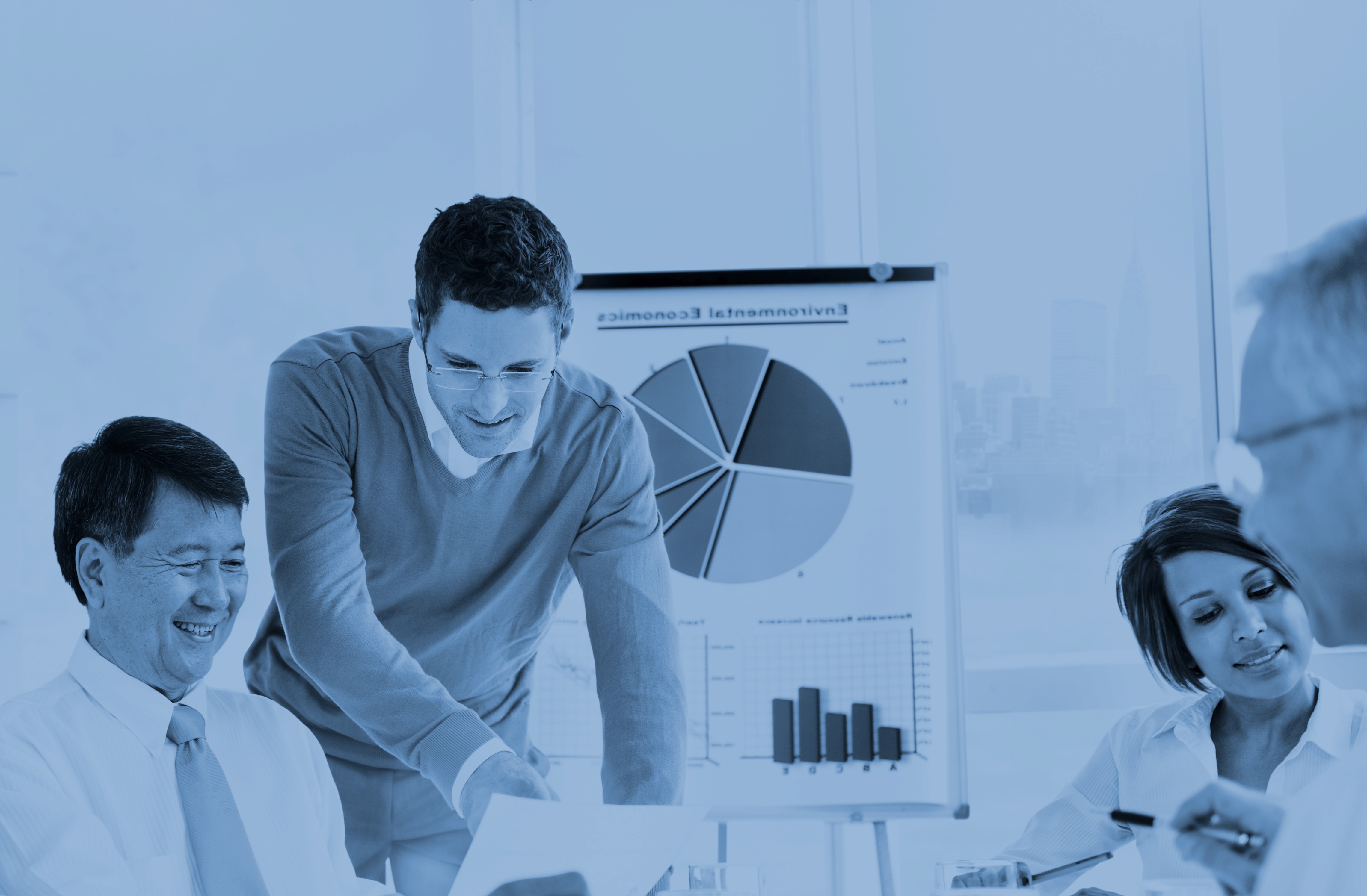 person working on blue and white paper on board