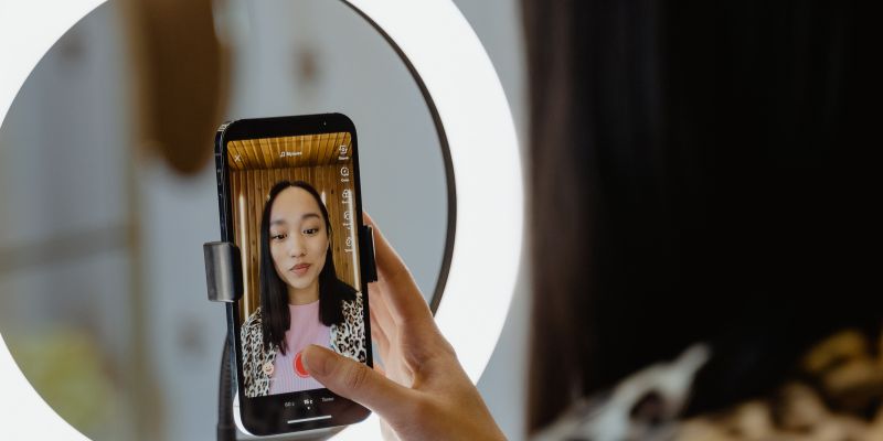 A Malaysian business owner shooting a video or doing a live on TikTok