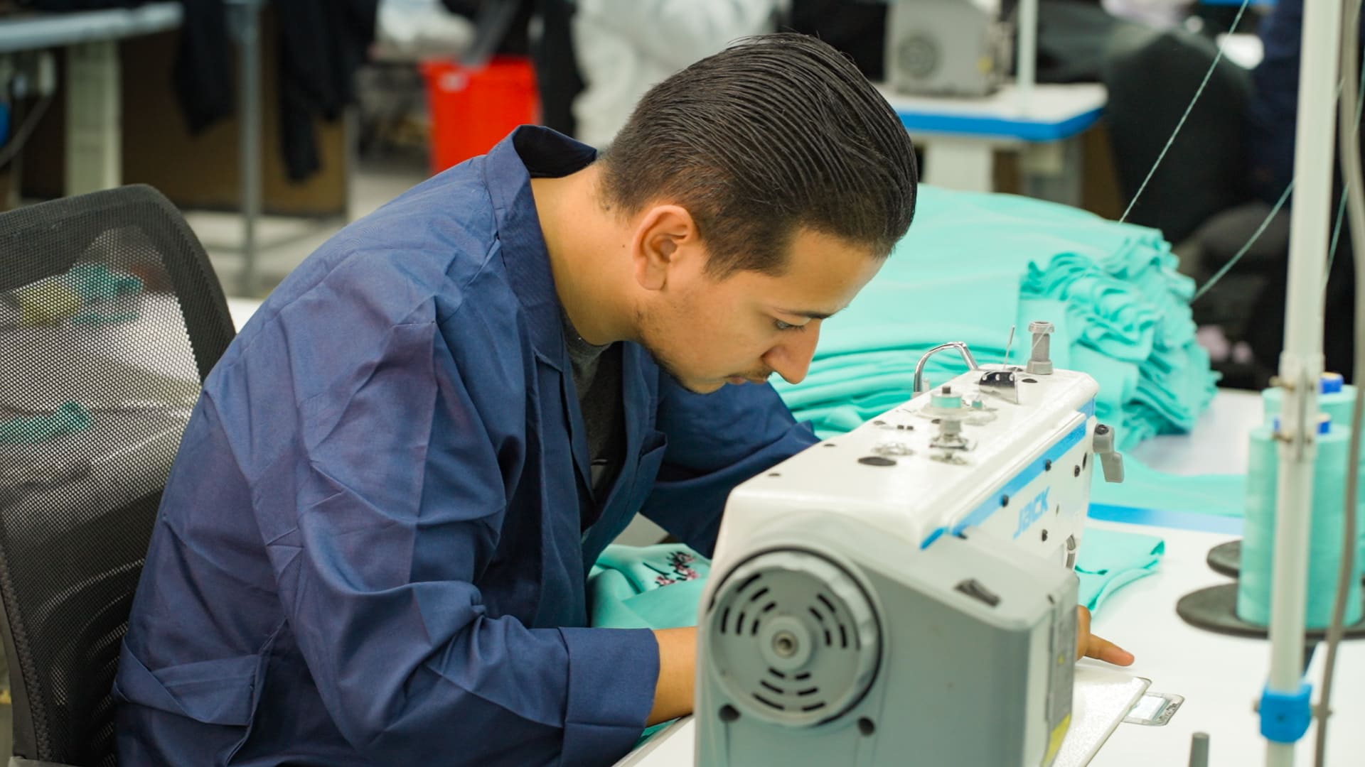 employee who works on the knitting machine.