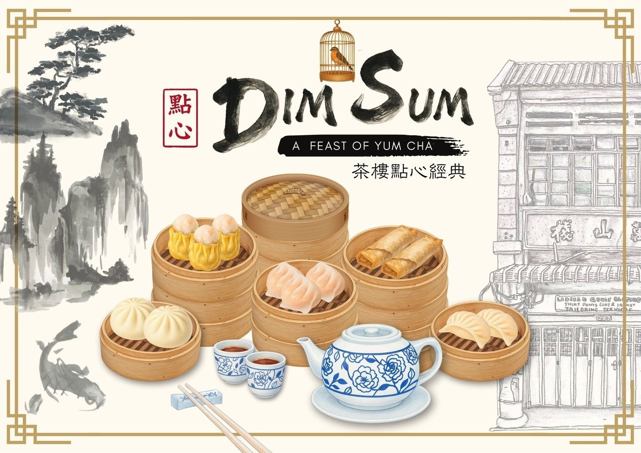 A close-up of a hand wearing multiple decorative rings against a blue background.