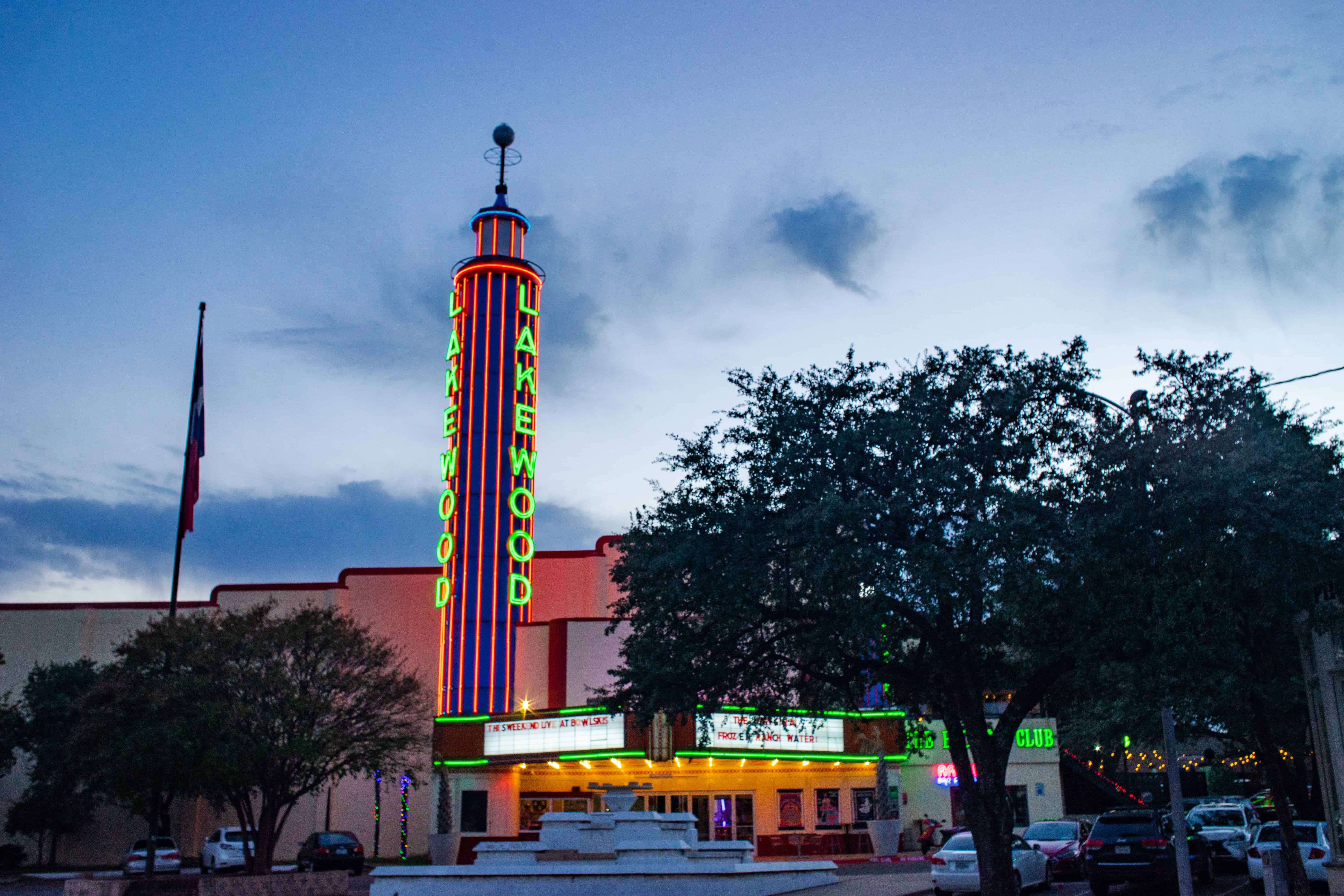 The neon tower of the Lakewood Theater at dusk, located near community-focused counseling services for teens and families in East Dallas.