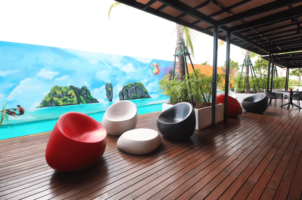 a restaurant with a large table and chairs