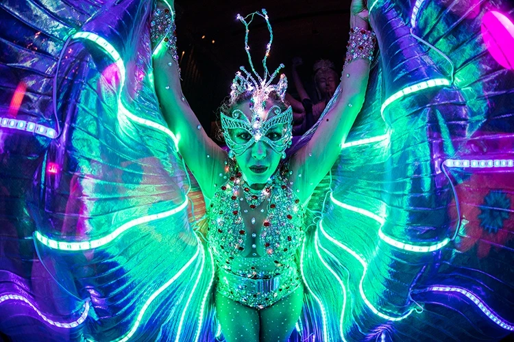 LED performer with glowing illuminated wings