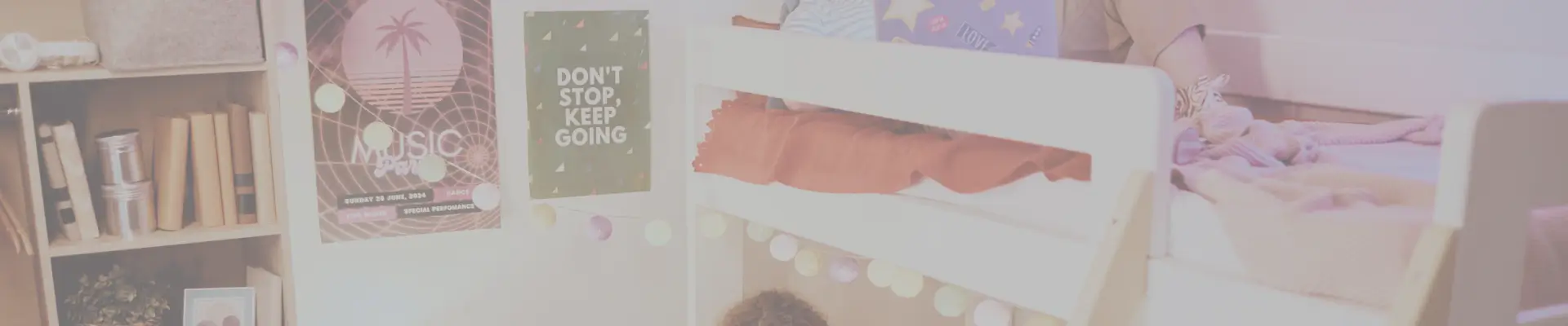 Personalized dorm room with posters, string lights, and storage – dorm decor ideas from a college packing list.