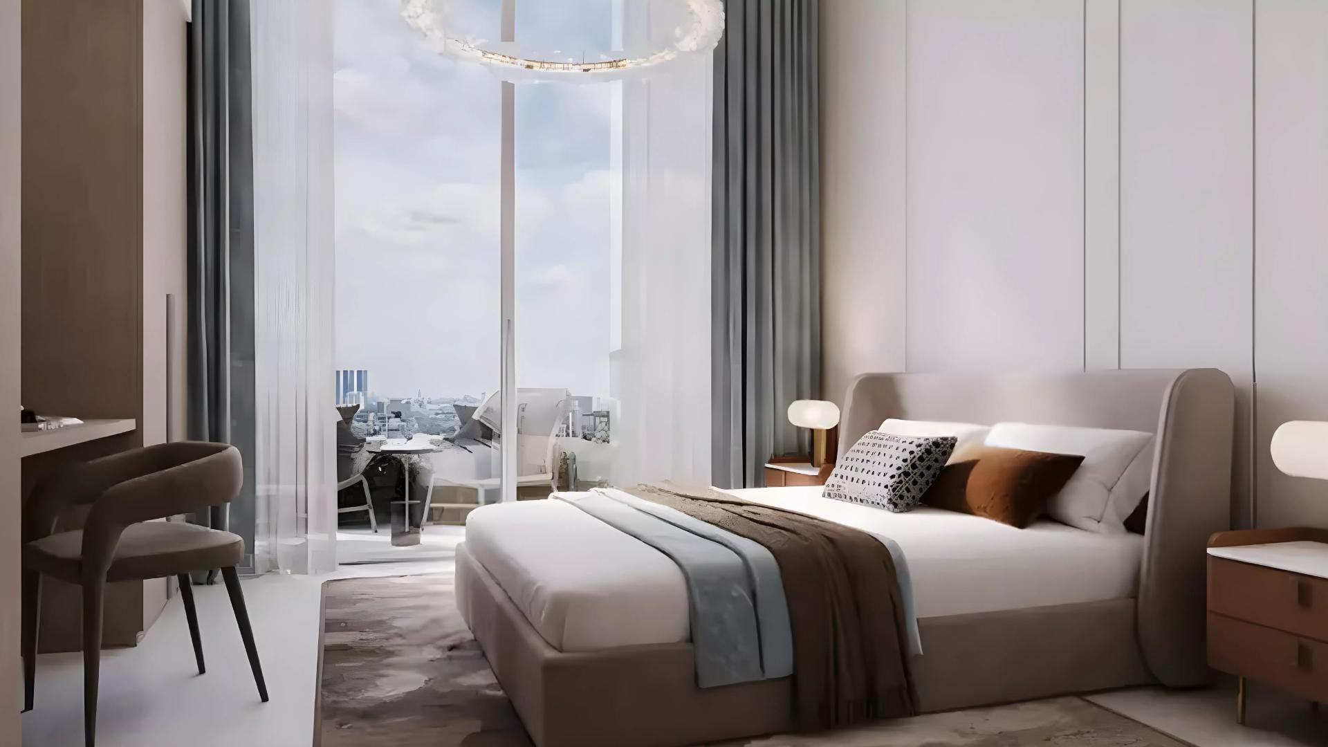 A modern bedroom featuring a large window with a view of the city skyline, designed in the Azizi Lina style.