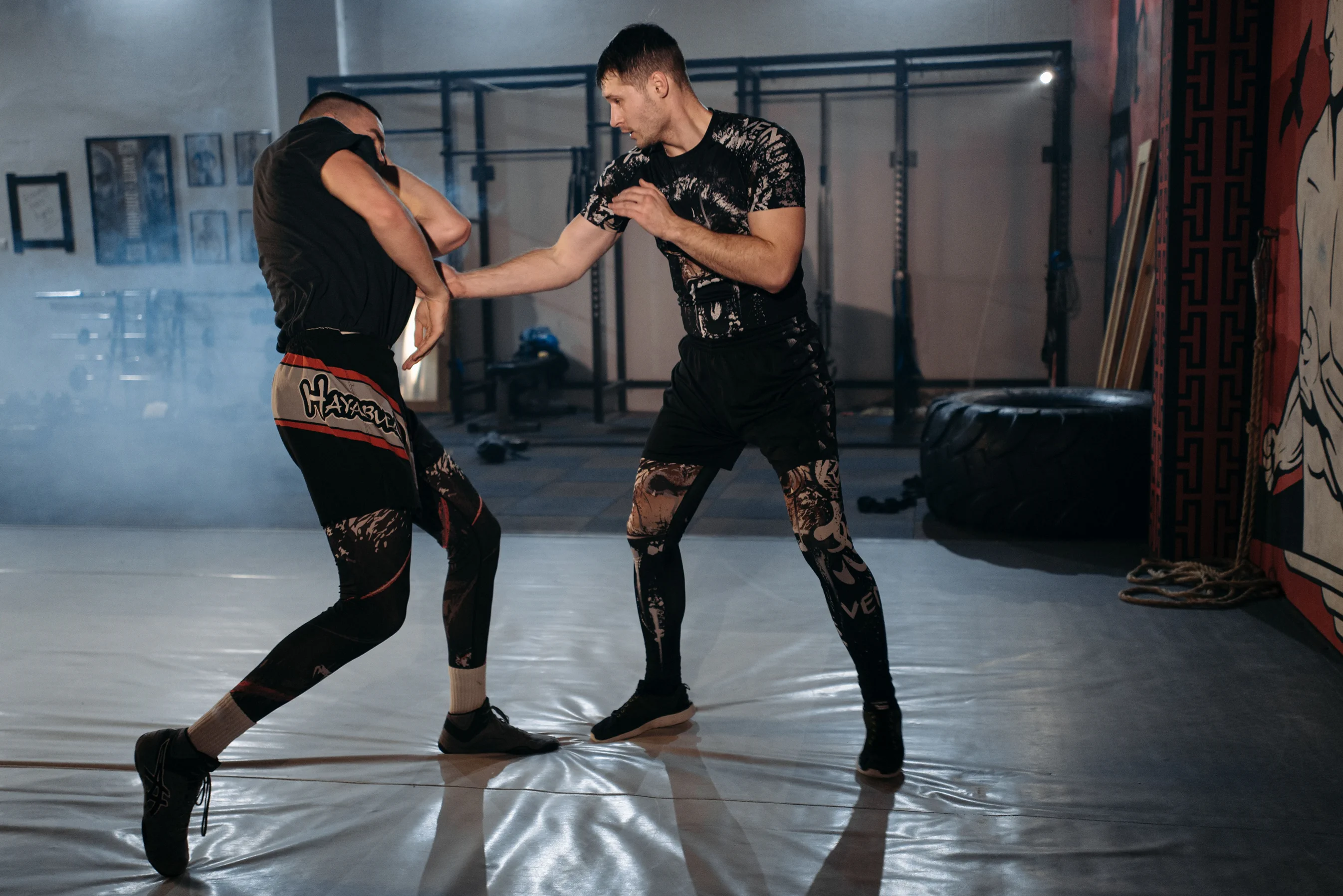 Two adults practicing martial arts partner drills at Rai Martial Arts.
