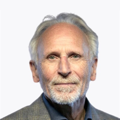 Headshot of employee, Flemming Olsen, on a blue tinted, grey background