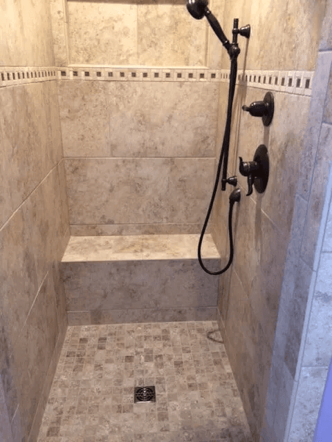 Elegant shower tile installation by Shilling's Carpets & Floors