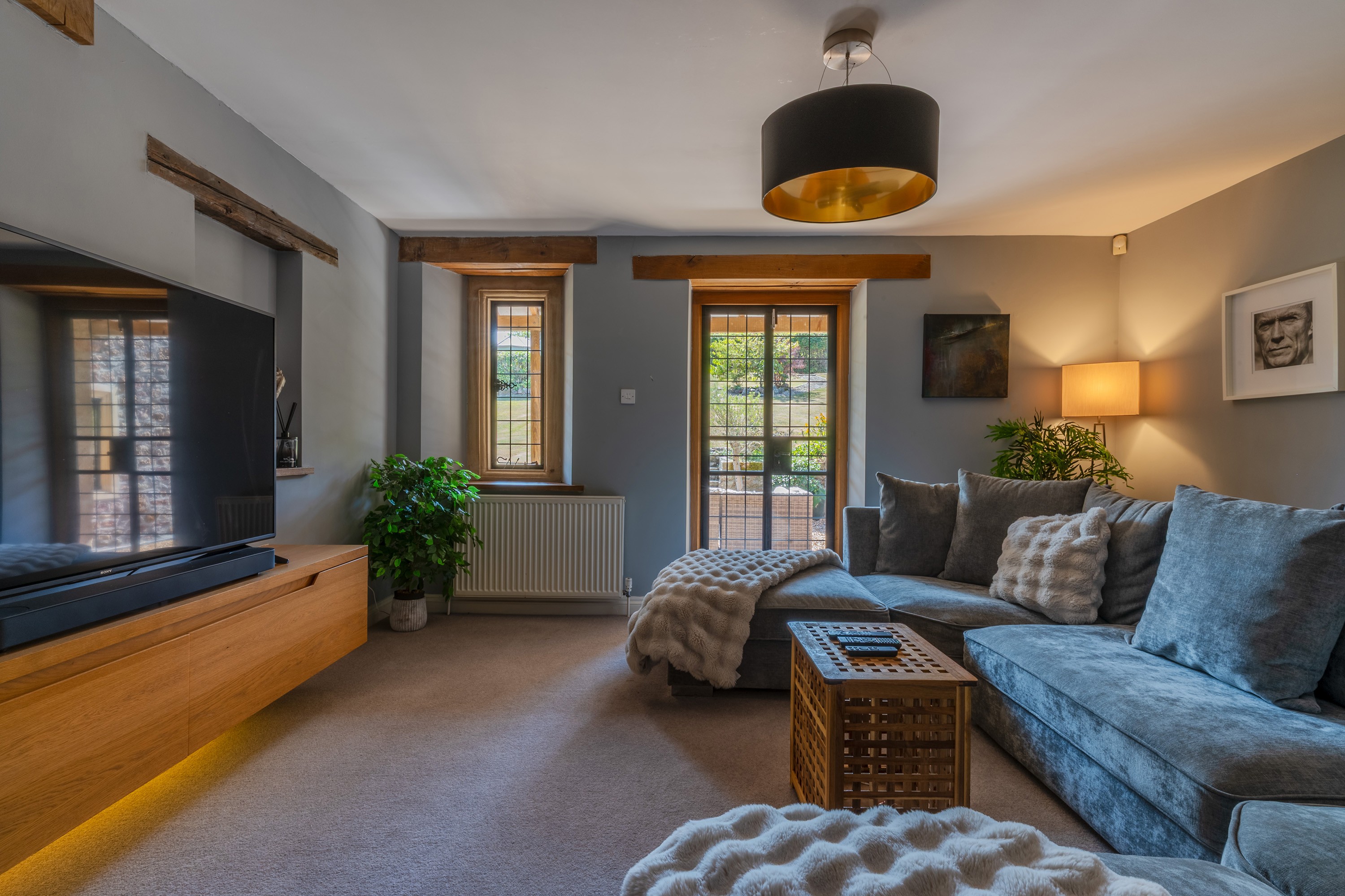 Snug at Shortcombe Barn with a beamed ceiling and windows onto the garden, West Harptree, Somerset — Captura Media