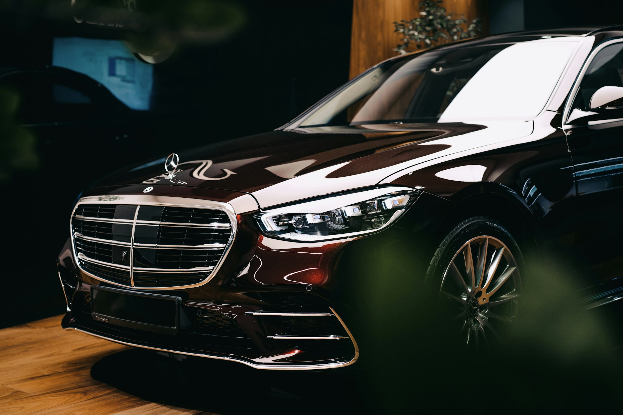 Black Mercedes-Benz S-Class first class sedan, front three-quarter view