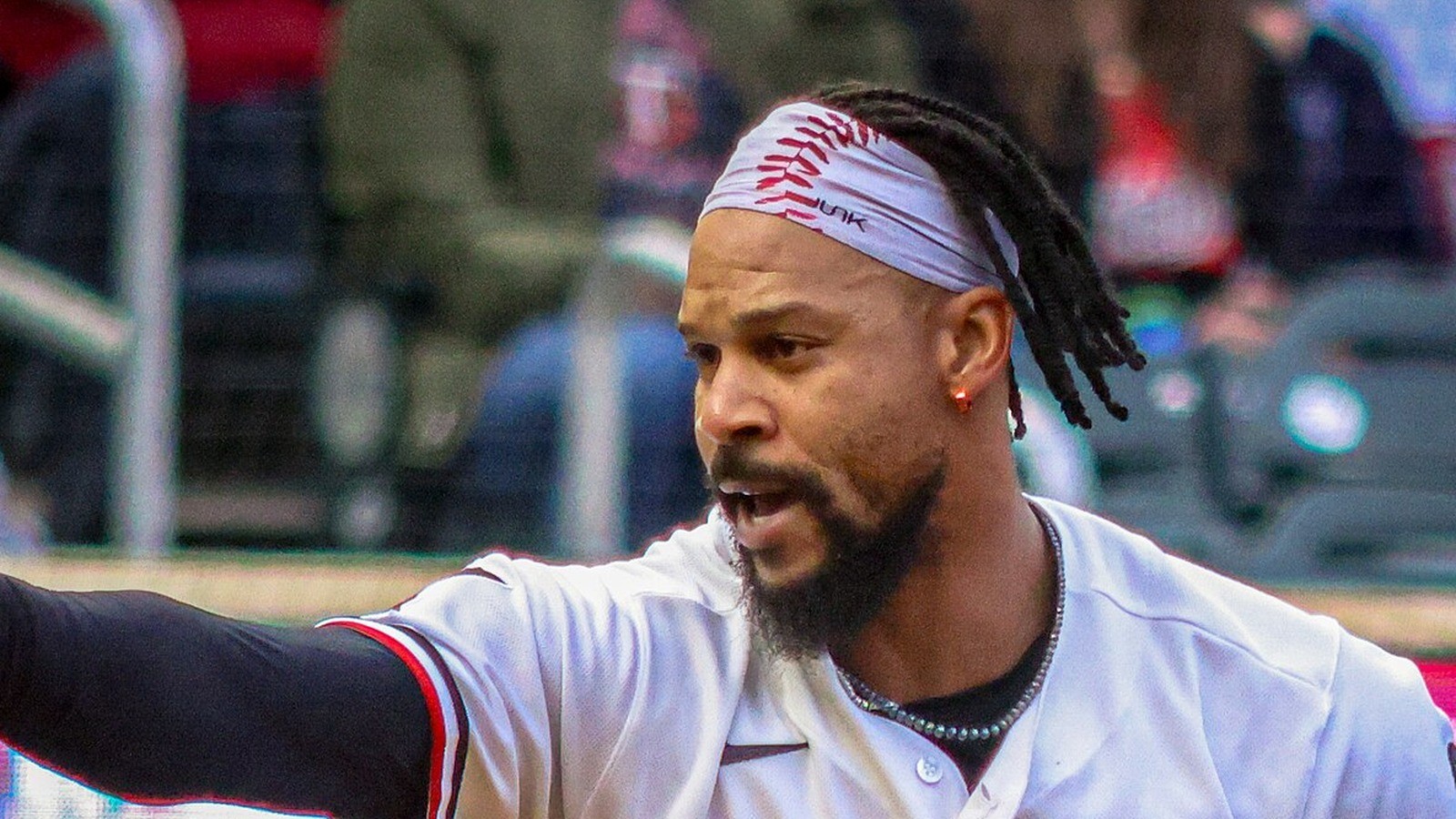 Close-up of Byron Buxton in a white headband looking left, face centered