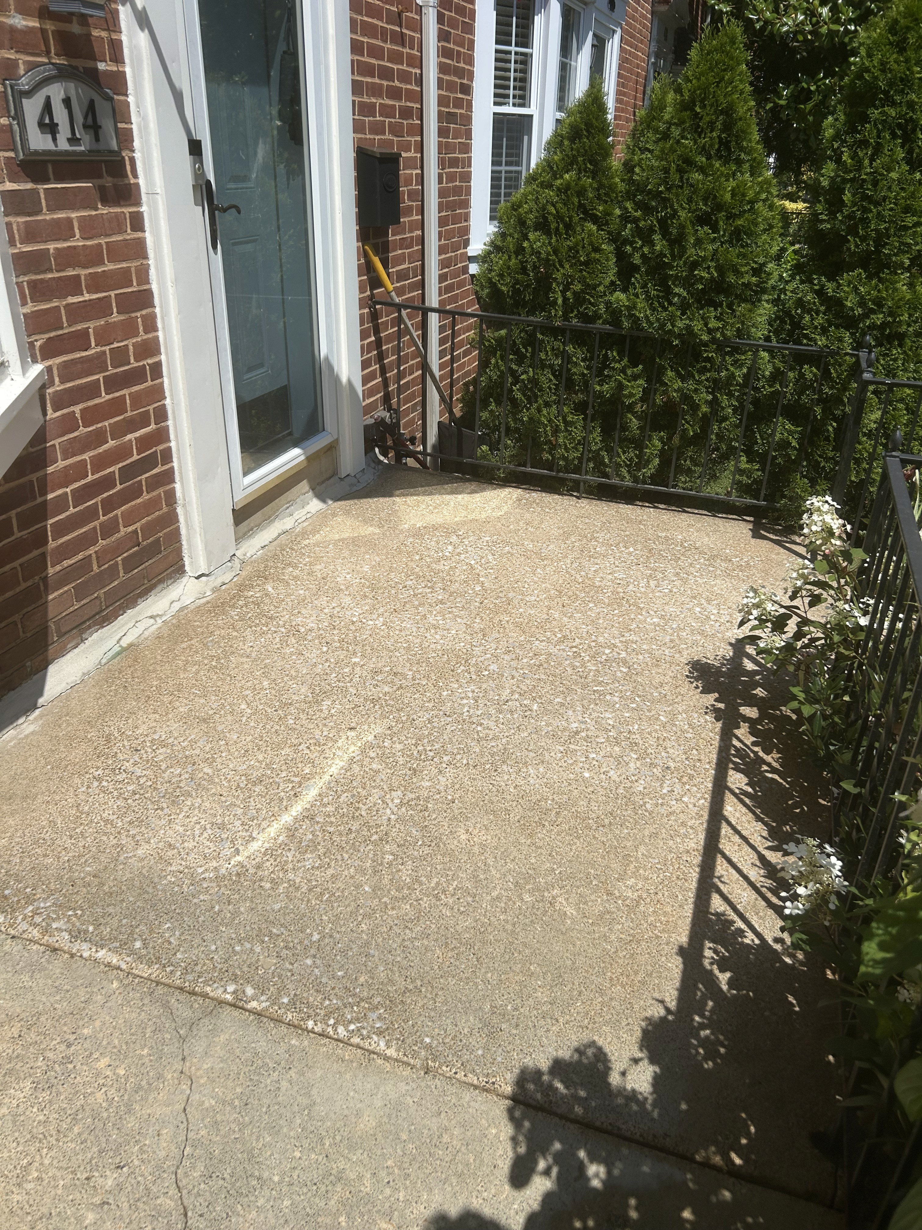 Clean front concrete porch and landing after pressure washing in Rodgers Forge.